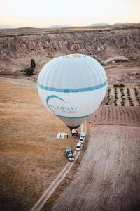 a hot air balloon in the middle of a field at Cappadocia Naif Hotel - Adults Only in Goreme