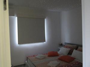 Ein Bett oder Betten in einem Zimmer der Unterkunft Novi Lux