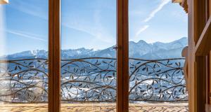 a window with a view of a mountain view at Dom Tatrzański Ewa Deluxe in Kościelisko