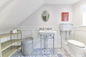 a white bathroom with a toilet and a sink at Host & Stay - Peacock House in Tynemouth