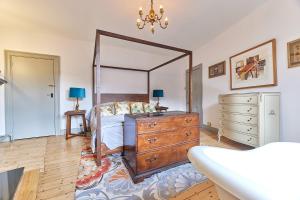 a bedroom with a dresser and a large mirror at Host & Stay - Peacock House in Tynemouth