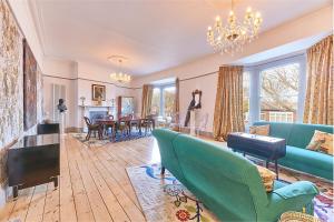 a living room with a couch and a dining room at Host & Stay - Peacock House in Tynemouth
