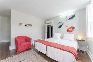 A bed or beds in a room at Olala Cosme Apartments