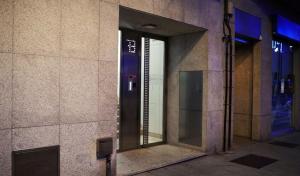 an entrance to a building with a glass door at Cíes Premium Suitel García Barbón 73 - Love your Stay in Vigo