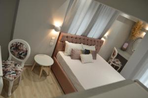 Posteľ alebo postele v izbe v ubytovaní kastro luxury studios and mezonette