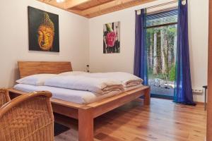 Ein Bett oder Betten in einem Zimmer der Unterkunft Bio-Ferienhaus-Eifel