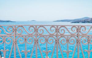 a view of the ocean from a balcony at Villa Selena - 1830s Art-House Suites in Vaporia, 50m from Asteria Beach in Ermoupoli +57 photos