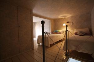 A bed or beds in a room at Residenza Maggiore With Panoramic View