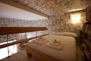 A bed or beds in a room at Residenza Maggiore With Panoramic View