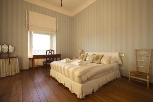 A bed or beds in a room at Residenza Maggiore With Panoramic View