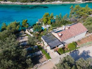 an aerial view of a house next to the water at Vila Perla in Vela Luka