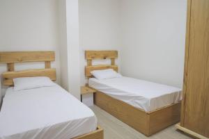 a room with two beds and a mirror at נווה חרמון in Majdal Shams +7 photos