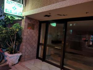 an entrance to a building with a revolving door at Superior Apartment in Korinthos