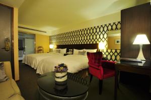 Ένα ή περισσότερα κρεβάτια σε δωμάτιο στο Delight Hotel
