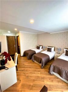 Rúm í herbergi á Hotel King David Bakuriani