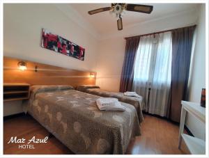 Una cama o camas en una habitación de Hotel Mar Azul