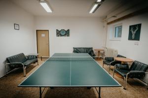 a conference room with a table and chairs at U Ztraceného potoka in Vápenná