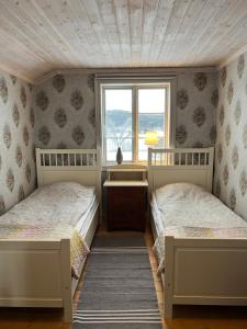 Una cama o camas en una habitación de Chinova Mötesgård i Järvsö