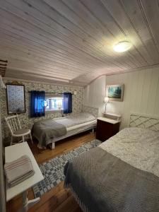 Una cama o camas en una habitación de Chinova Mötesgård i Järvsö