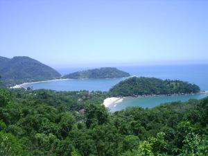 an island in the middle of a body of water at Calumar Guest House in Ubatuba