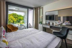 Postel nebo postele na pokoji v ubytování Open Hotel Szentes + 13 fotografií