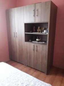 a large wooden cabinet in the corner of a room at Galerija Jovanović in Topola