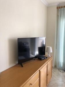 Televízia a/alebo spoločenská miestnosť v ubytovaní Thalassa 2-4 - Piso precioso a 50 m de la playa