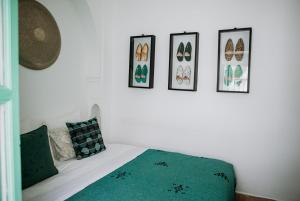 Postel nebo postele na pokoji v ubytování Riad Le Limoun and Spa