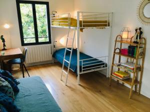 a bedroom with two bunk beds and a desk at Villa Poggio in Santa-Maria-Poggio +19 photos