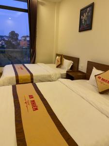 Postel nebo postele na pokoji v ubytování An Nhien Hotel