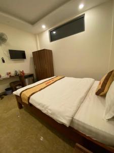 Postel nebo postele na pokoji v ubytování An Nhien Hotel