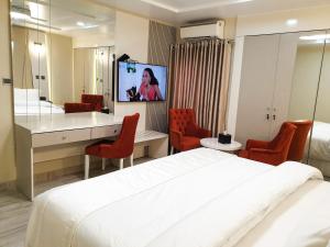 Vuode tai vuoteita majoituspaikassa Musada Luxury Hotels and Suites