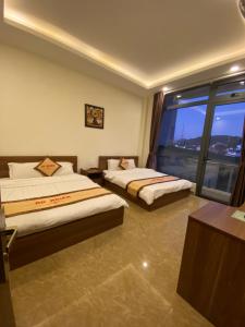 Postel nebo postele na pokoji v ubytování An Nhien Hotel