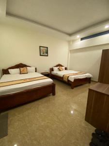 Postel nebo postele na pokoji v ubytování An Nhien Hotel