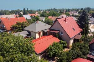 an overhead view of a village with red roofs at Árnyas Vendégház , Lila akác apartman in Balatonboglár