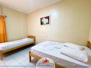 Ein Bett oder Betten in einem Zimmer der Unterkunft Hotel Estação de Minas
