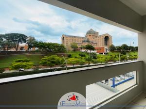 a view of a city from a window in a building at Hotel Estação de Minas in Aparecida