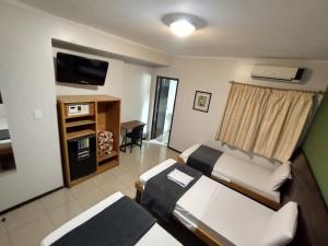 TV a/nebo společenská místnost v ubytování Hotel Cidade