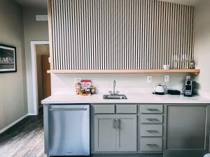 a kitchen with a sink and a counter at Flying Flags Avila Beach in Avila Beach