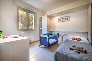 Кровать или кровати в номере Mareblù - Tuscany Green Aparthotel