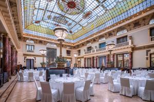 a large room filled with tables and chairs at Metropol in Moscow