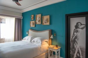 Ліжко або ліжка в номері Capri Tiberio Palace - The Leading Hotels of the World