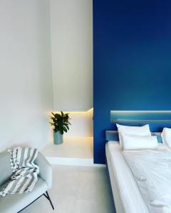 Un pat sau paturi într-o cameră la KOOON