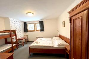 Postel nebo postele na pokoji v ubytování Hotel Modrava