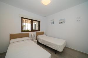 A bed or beds in a room at Linara