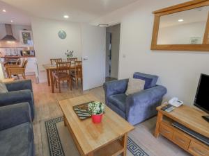 a living room with a couch and a coffee table at Pierpont D1 in Yarmouth