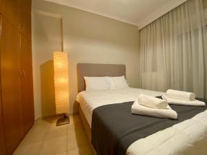 Postel nebo postele na pokoji v ubytování DreamHouse Afroditis - Komotini
