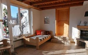 a living room with a couch in front of a window at Ferienwohnung Ott Schongau in Schongau