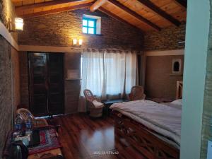 Ένα ή περισσότερα κρεβάτια σε δωμάτιο στο Meraki Huts