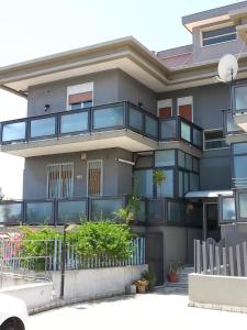 a building with balconies on the side of it at B&B United States of Europe in Catania